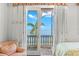 Bedroom with French doors opening to a waterfront balcony at 101 12Th E St, Tierra Verde, FL 33715