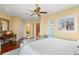 Spacious main bedroom with hardwood floors, sitting area, and large window with shutters at 101 12Th E St, Tierra Verde, FL 33715