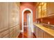 Butlers pantry with ample storage and granite countertops at 101 12Th E St, Tierra Verde, FL 33715
