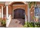 Impressive entry with double doors and classic architecture at 101 12Th E St, Tierra Verde, FL 33715