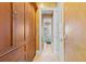 A hallway with built-in wooden cabinets and access to bedrooms at 101 12Th E St, Tierra Verde, FL 33715