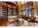 Luxurious library with custom built-ins and a comfortable sitting area at 101 12Th E St, Tierra Verde, FL 33715