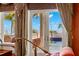 Main bedroom with access to a balcony and pool area at 101 12Th E St, Tierra Verde, FL 33715