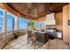 Elegant outdoor kitchen with bar seating and water views at 101 12Th E St, Tierra Verde, FL 33715