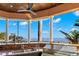 Outdoor kitchen with granite counters and stunning water views at 101 12Th E St, Tierra Verde, FL 33715