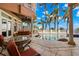 Relaxing pool area with patio furniture and stunning water views at 101 12Th E St, Tierra Verde, FL 33715