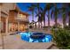 Inviting pool and spa area with expansive patio and lush landscaping at 101 12Th E St, Tierra Verde, FL 33715