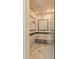 Large walk-in shower with tiled walls and built-in bench at 101 12Th E St, Tierra Verde, FL 33715