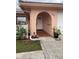 Inviting front entrance with tiled walkway and landscaping at 10467 Larchmont N Pl, Pinellas Park, FL 33782