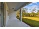 Covered back patio with access to a grassy backyard at 12620 Glenn Creek Dr, Riverview, FL 33569