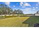 Large backyard with grassy area and a pond at 12620 Glenn Creek Dr, Riverview, FL 33569