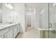 Modern bathroom with double vanity and walk-in shower at 12620 Glenn Creek Dr, Riverview, FL 33569