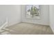 Bright bedroom with neutral carpet and a window with blinds at 12620 Glenn Creek Dr, Riverview, FL 33569