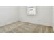 Simple bedroom with neutral carpet and a window with blinds at 12620 Glenn Creek Dr, Riverview, FL 33569