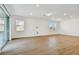 Spacious bonus room with hardwood floors and sliding door access at 12620 Glenn Creek Dr, Riverview, FL 33569