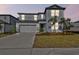 Two-story house with gray exterior and landscaping at 12620 Glenn Creek Dr, Riverview, FL 33569