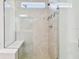 Large walk-in shower with tile surround and built-in seat at 12620 Glenn Creek Dr, Riverview, FL 33569
