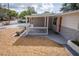 House exterior with a covered porch and landscaping at 1537 Excalibur St, Holiday, FL 34690
