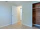 Bright bedroom with tile floors and a spacious closet at 1537 Excalibur St, Holiday, FL 34690