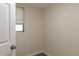 Small, well-lit basement closet with single window at 1537 Excalibur St, Holiday, FL 34690