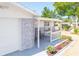 Covered porch with gray stone and white railings at 1537 Excalibur St, Holiday, FL 34690