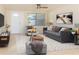Spacious living room with comfy sofa and large window at 1537 Excalibur St, Holiday, FL 34690