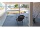Relaxing covered porch with seating and small table at 1537 Excalibur St, Holiday, FL 34690