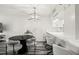 Modern dining area with black table and gray chairs at 201 W Laurel St # 609, Tampa, FL 33602