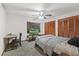 Bedroom with a double bed, desk, and large closet at 223 S Riverhills Dr, Temple Terrace, FL 33617