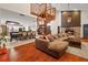 Open living space with a spiral staircase, hardwood floors, and a fireplace at 223 S Riverhills Dr, Temple Terrace, FL 33617