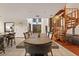 Long dining table with seating for eight, overlooking the living room at 223 S Riverhills Dr, Temple Terrace, FL 33617