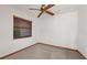 Small bedroom with ceiling fan and window at 223 S Riverhills Dr, Temple Terrace, FL 33617