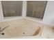 Bathroom featuring a corner jacuzzi tub with jets at 223 S Riverhills Dr, Temple Terrace, FL 33617