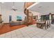 Living room with fireplace and spiral staircase at 223 S Riverhills Dr, Temple Terrace, FL 33617