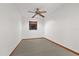 Small bedroom with ceiling fan and window at 223 S Riverhills Dr, Temple Terrace, FL 33617