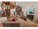 Living area features a large sectional sofa, fireplace and a spiral staircase at 223 S Riverhills Dr, Temple Terrace, FL 33617