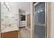 Clean bathroom with double vanity, shower, and bathtub at 223 S Riverhills Dr, Temple Terrace, FL 33617