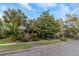 Two-story home with lush landscaping and brick walkway at 255 16Th Ne Ave, St Petersburg, FL 33704