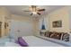 Main bedroom with a king-size bed and ceiling fan at 255 16Th Ne Ave, St Petersburg, FL 33704