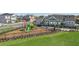 Triangular fenced playground with modern play equipment at 28732 Rambutan Dr, Wesley Chapel, FL 33543