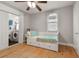 Charming bedroom with built-in drawers and adjacent laundry at 311 N Bradford Ave, Tampa, FL 33609