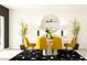 Modern dining room with yellow chairs and a round table at 3761 Capital Reserve Dr, Plant City, FL 33565