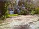 Large backyard with shed and mature trees at 38424 Fir Ave, Zephyrhills, FL 33542