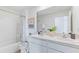 Bathroom with double vanity, shower, and bathtub at 5260 Salt Marsh Rd, Wimauma, FL 33598