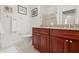 Bathroom with granite countertops and wood cabinets at 604 S Tampania Ave # C, Tampa, FL 33609