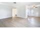 Spacious living room with light wood-look floors and an open floor plan at 6269 Skyline Ct, Spring Hill, FL 34606