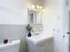 Clean bathroom with updated vanity and tiled walls at 6269 Skyline Ct, Spring Hill, FL 34606