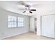 Bright bedroom with ceiling fan, window, and closet at 6269 Skyline Ct, Spring Hill, FL 34606