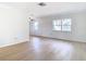 Open living room with new flooring and large windows at 6269 Skyline Ct, Spring Hill, FL 34606