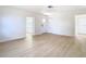 Spacious living area with light hardwood floors and an open floor plan at 6269 Skyline Ct, Spring Hill, FL 34606